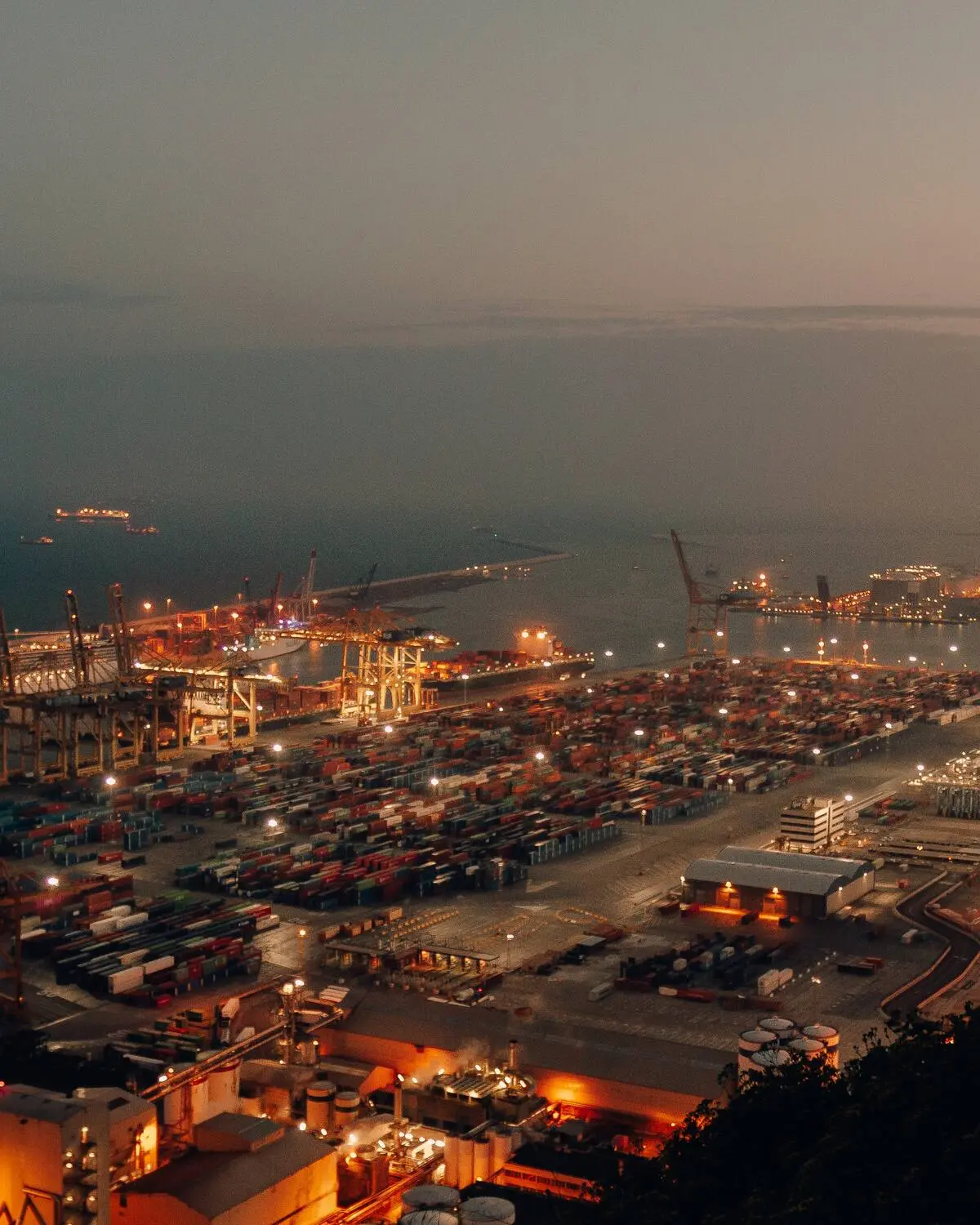 Aerial view of a container port at dusk