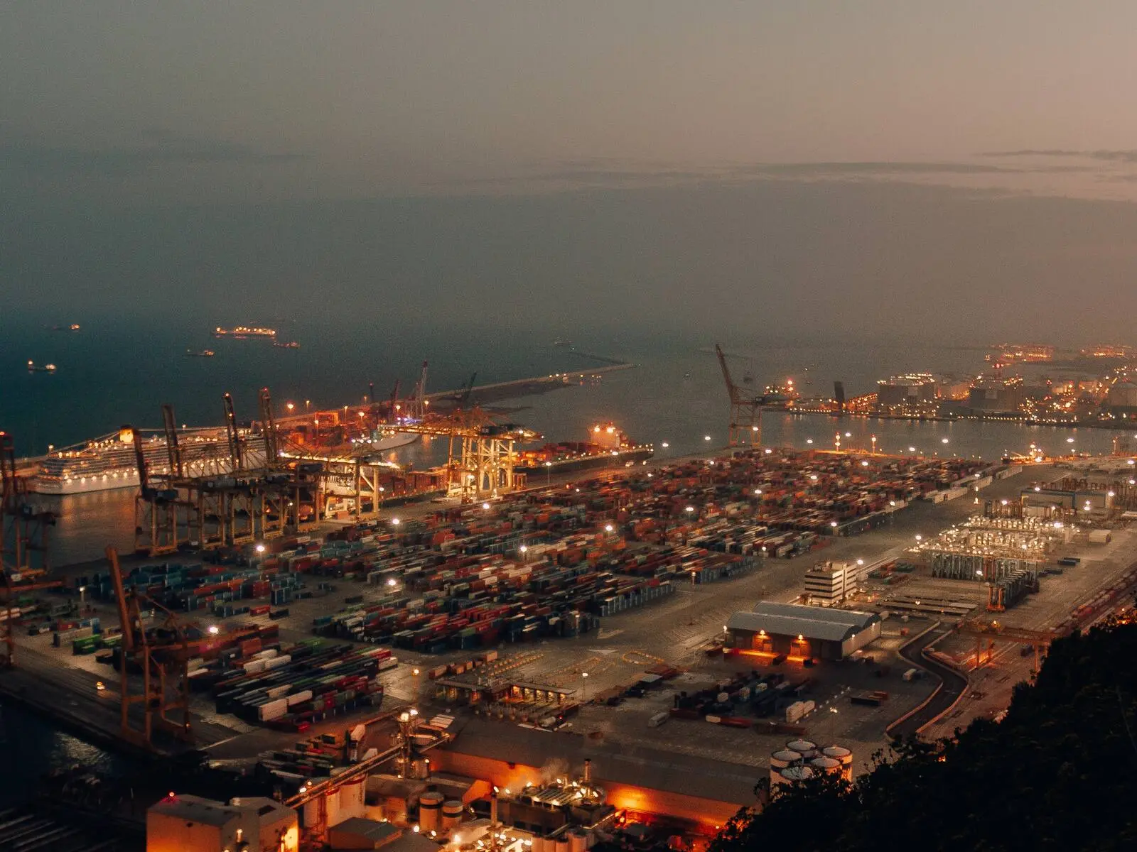 Aerial view of a container port at dusk